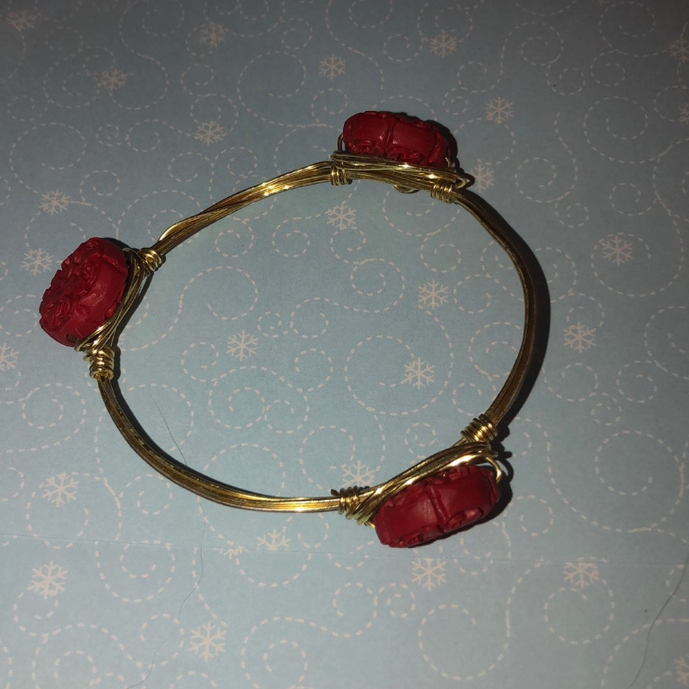 Gold wire bangle with red beads